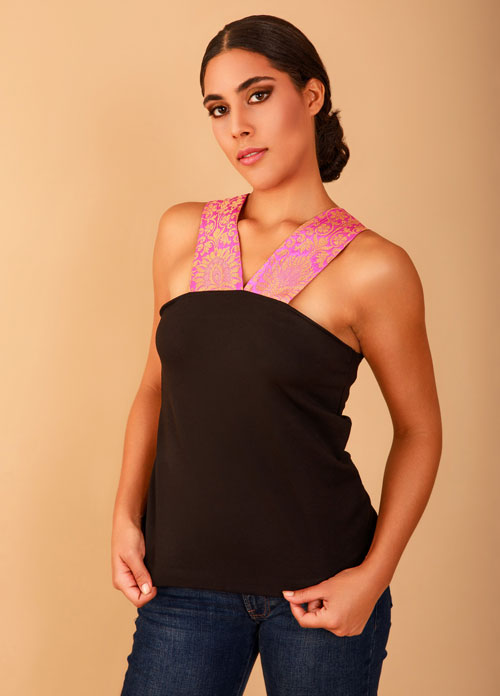 a model in a black top with pink lace detail