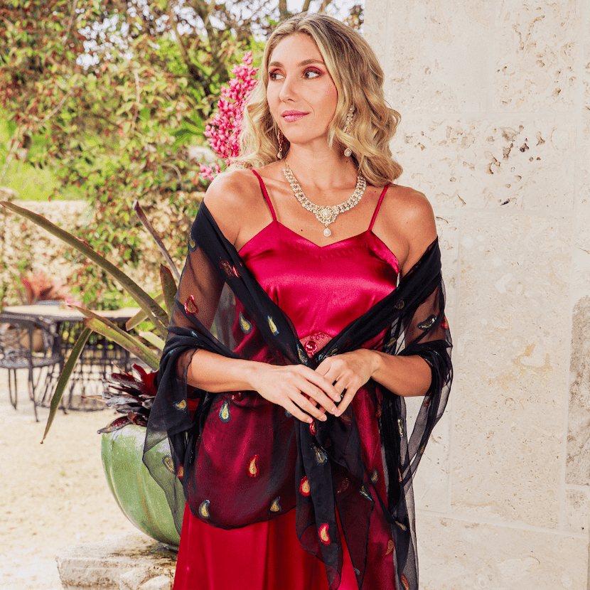 woman in red dress with black scarf 