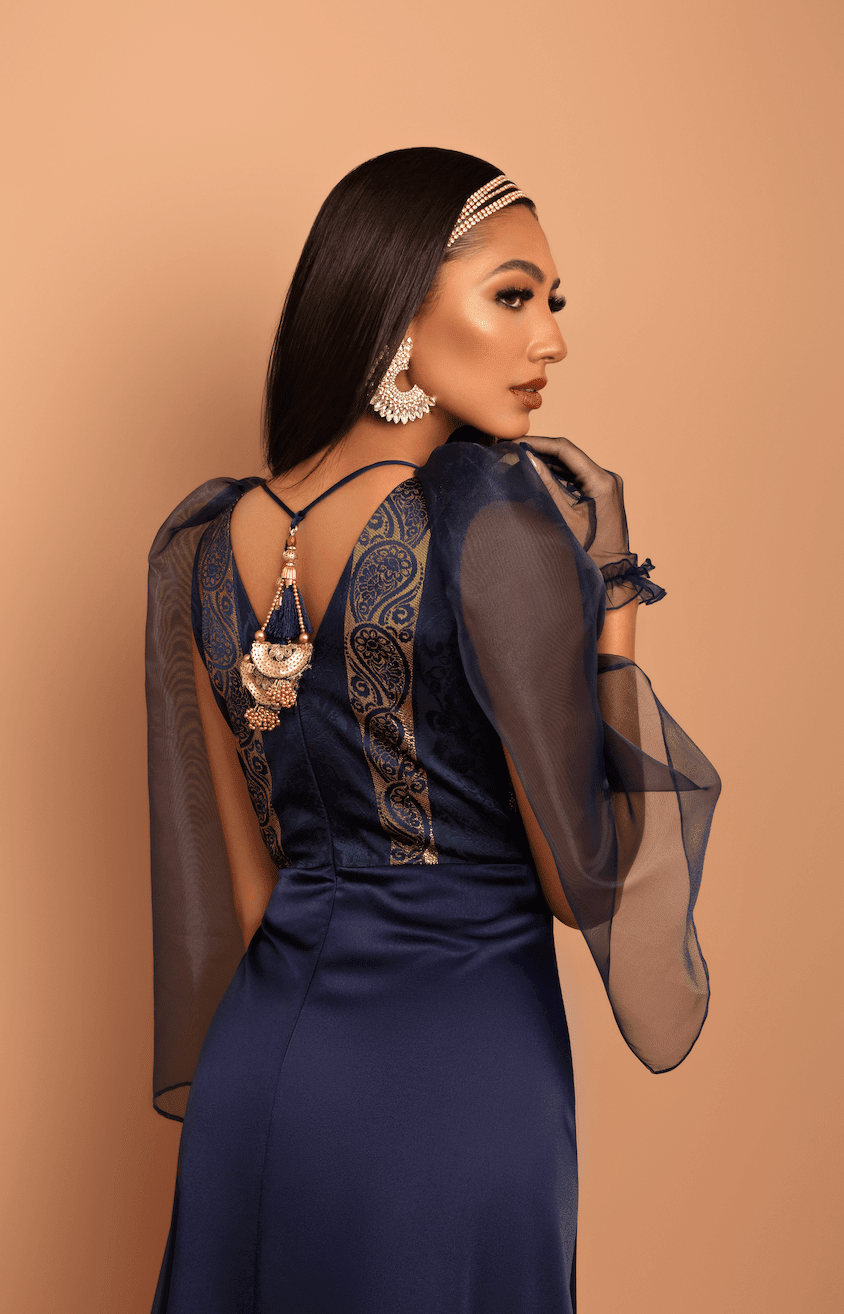 woman in blue dress with tassels