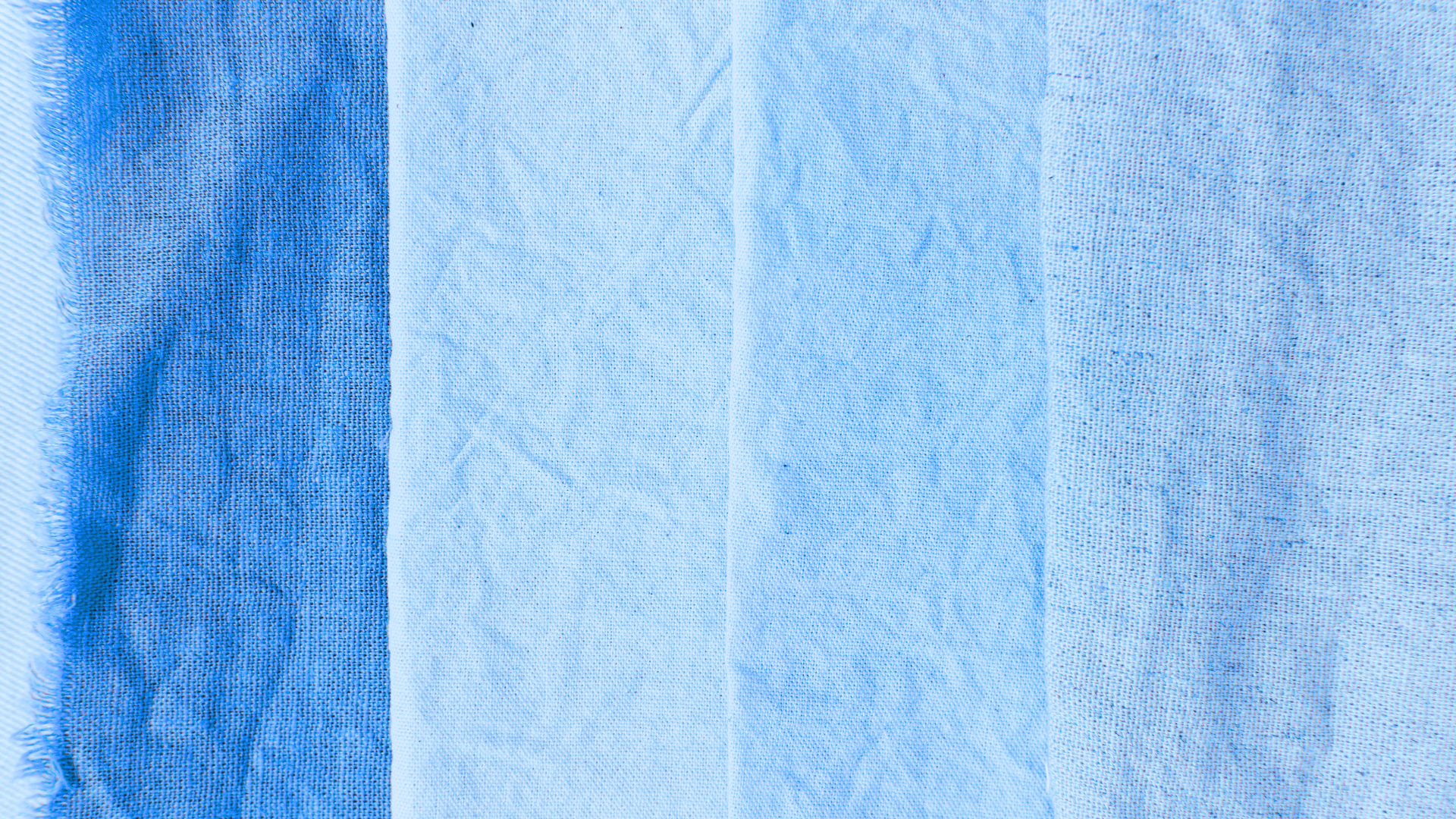 variety of blue fabric swatches