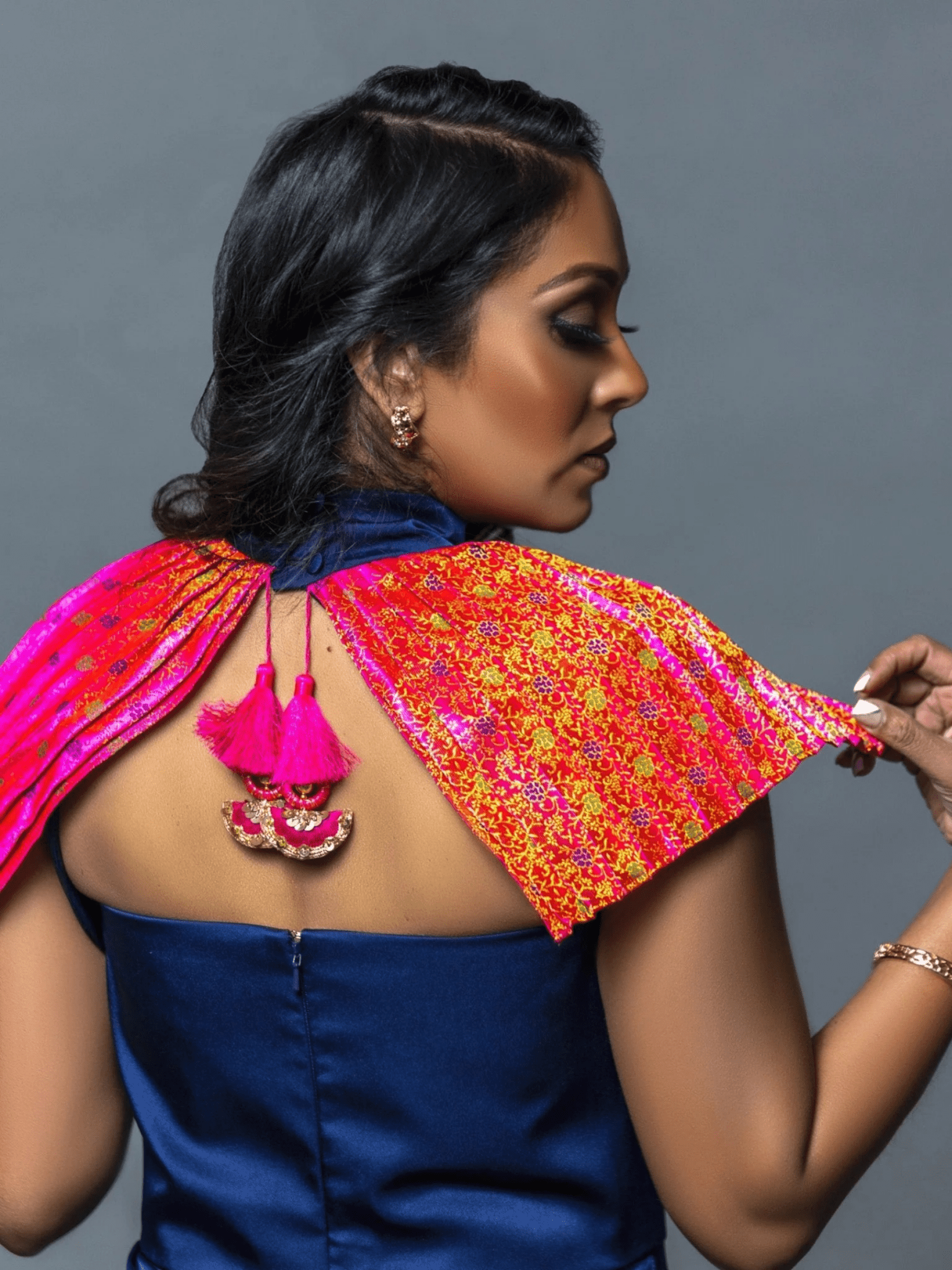 Close-up of the blue Vivanna dress highlighting its textured fabric, delicate detailing, and refined neckline.