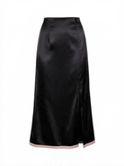 Shop The Belle Skirt by La' Agra, an artisan-crafted skirt in green, lilac, and black with South Asian–inspired detail and a modern silhouette.