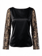 The Petal Top by La' Agra: a black top with delicate lace sleeves and artisan-crafted detail. Pair it with a bold skirt or tailored trousers.