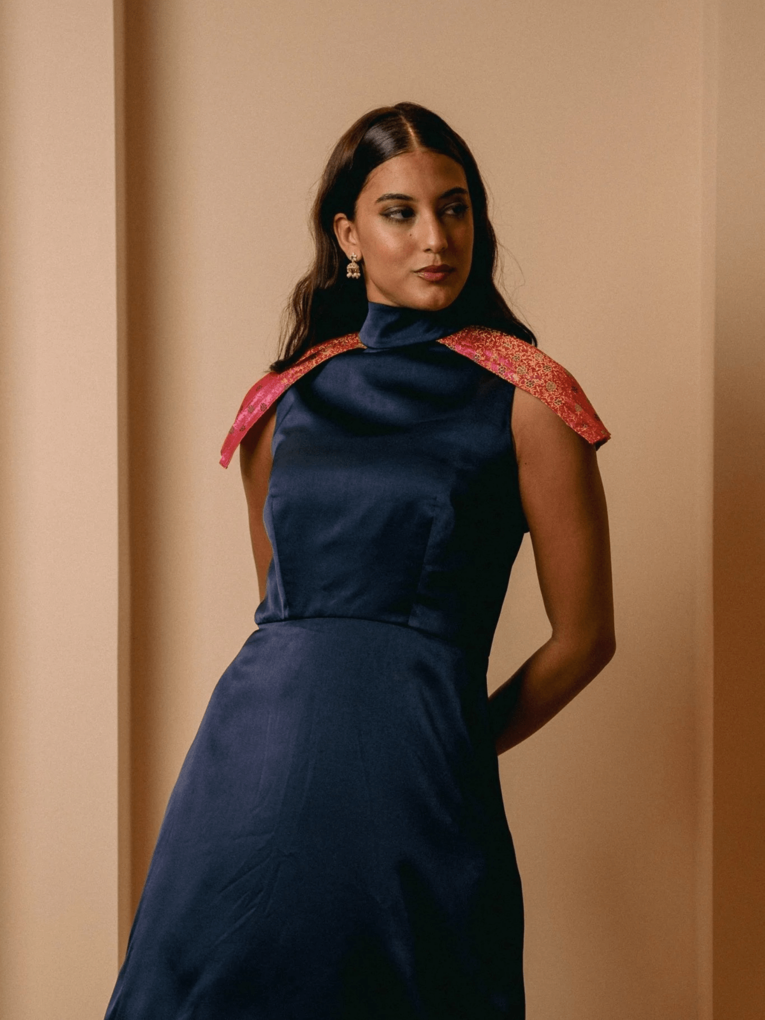 Model wearing the blue Vivanna dress, an artisan-crafted piece with South Asian–inspired detailing and a modern, fluid silhouette.