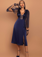 Model wearing a  blue dress, an artisan-crafted piece with South Asian–inspired detailing and a modern, refined silhouette.