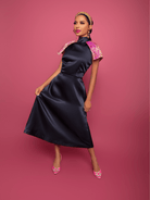 Woman in Blue Dress with Pink Sleeves
