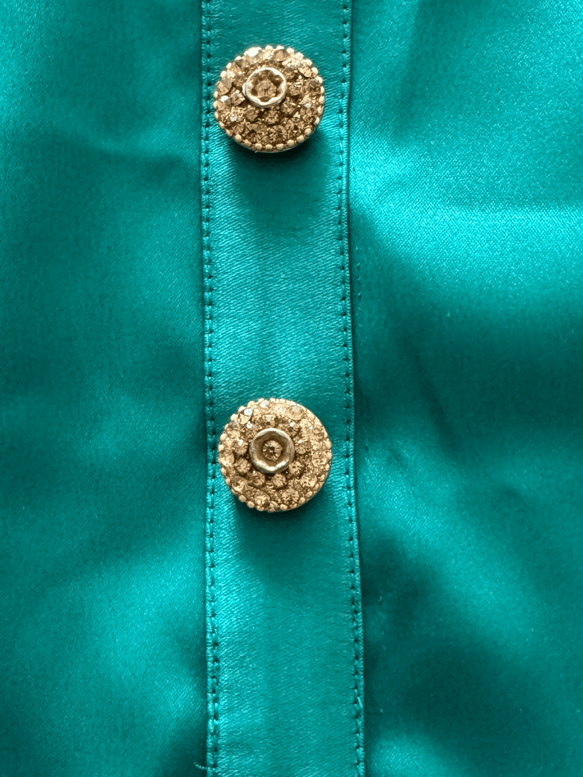 La' Agra emerald green silk camisole featuring ornate gold textured buttons on a vertical placket