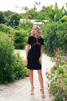 a model in a black lace dress