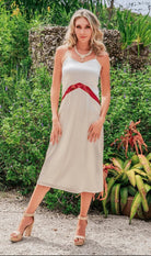 a model in a cream satin midi dress